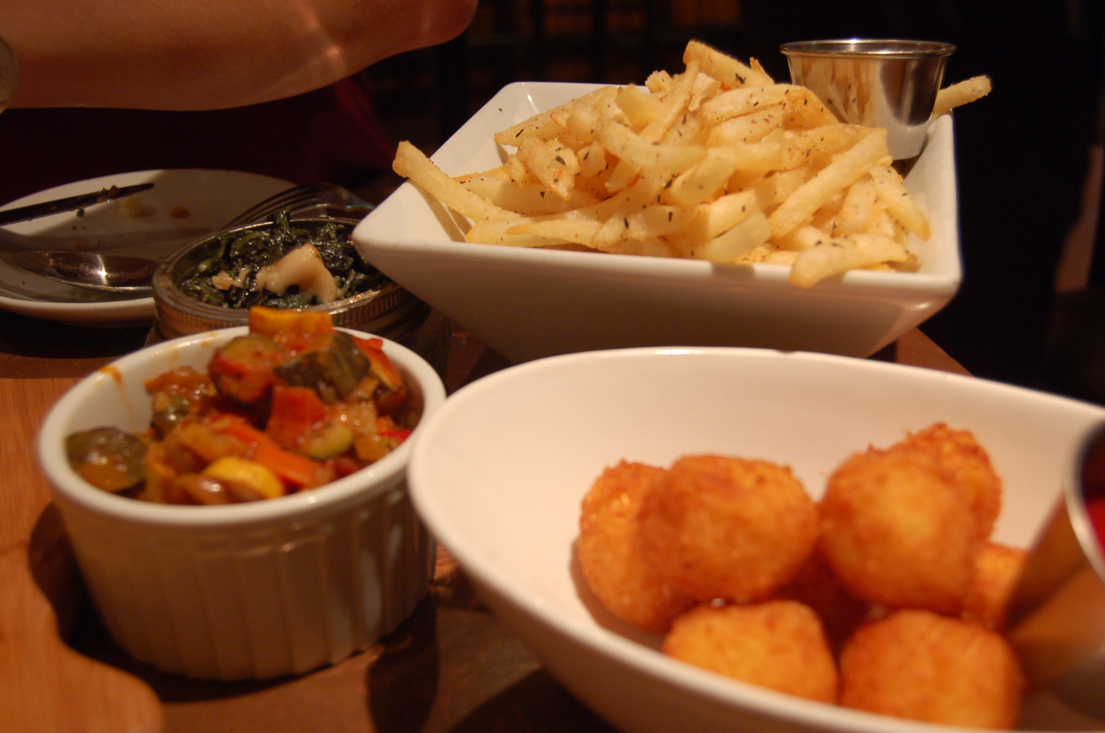 bowls filled with food sit next to each other on a table