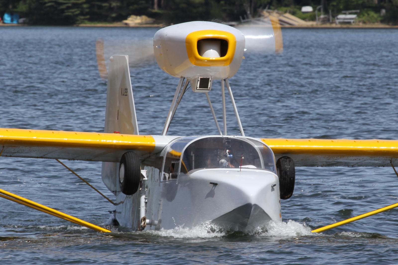 a small boat with a propeller is in the water