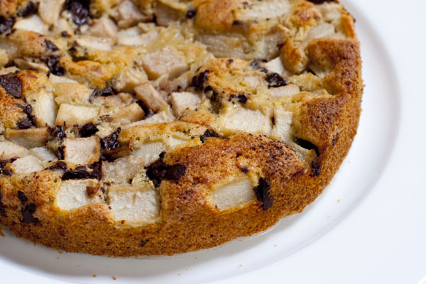 a baked dessert on a plate is topped with chocolate chips