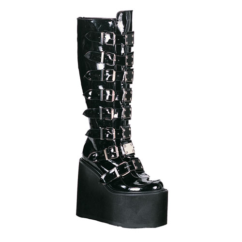 there is a very tall boot with spikes on it