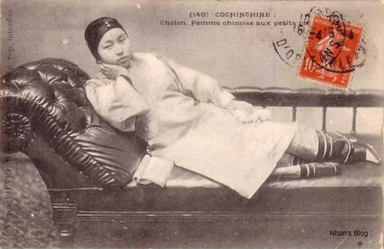 there is a young woman sitting on a leather chair