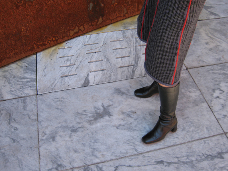 a close up of a person standing with their foot on the ground