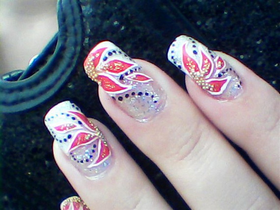 a manicure with red and blue designs on it