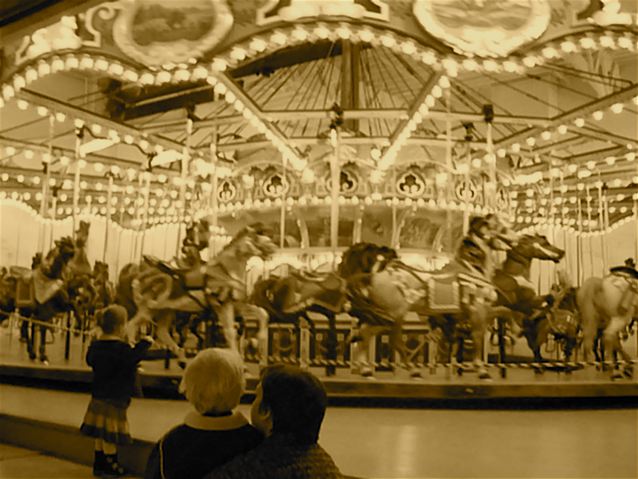 vintage po of two children on a carousel