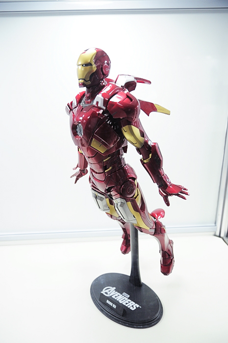 iron man figure displayed on display in glass case