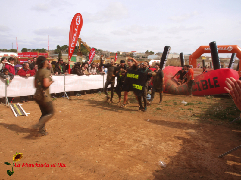 people running in a field during an obstacle event