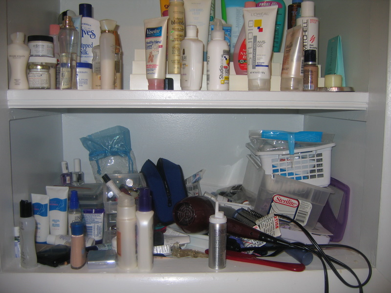 an organized cupboard contains all kinds of grooming products