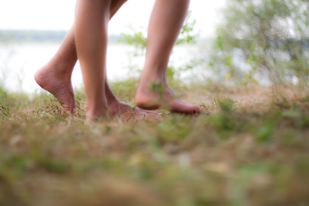 an individual has bare legs and bare feet