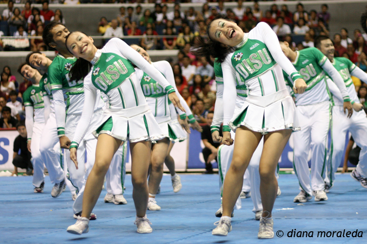 a group of cheerleaders performing a routine for the crowd
