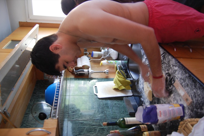 a young man is making bread in his kitchen