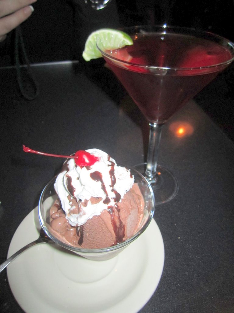 two martinis sit on a counter, one with a chocolate base