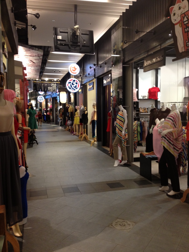 a large open room with several people walking through it