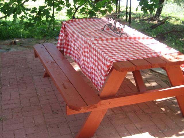 there is a picnic table set up for two people