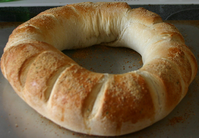 a close up of a bagel on a pan