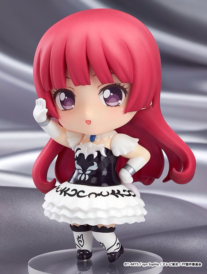 a doll with red hair is posed for a po