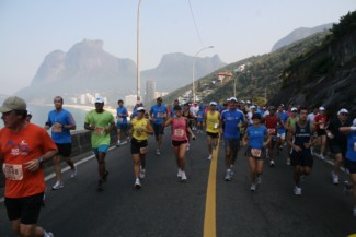 a group of people on a road running