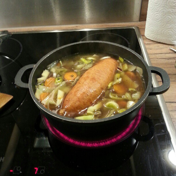 a fish is on the stove in a pot