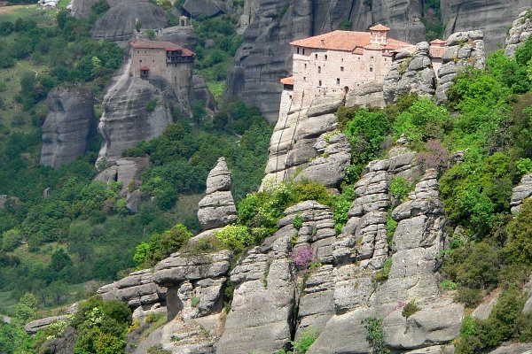 the view of a village and mountains is seen from below