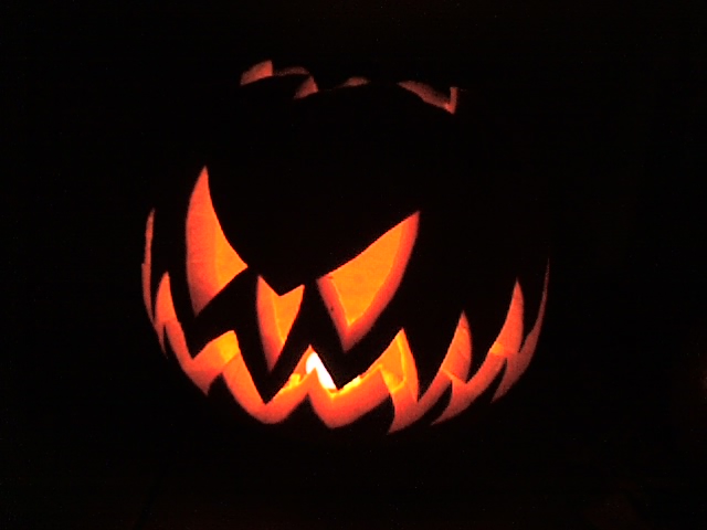 an illuminated jack o lanterns pumpkin lit up for halloween
