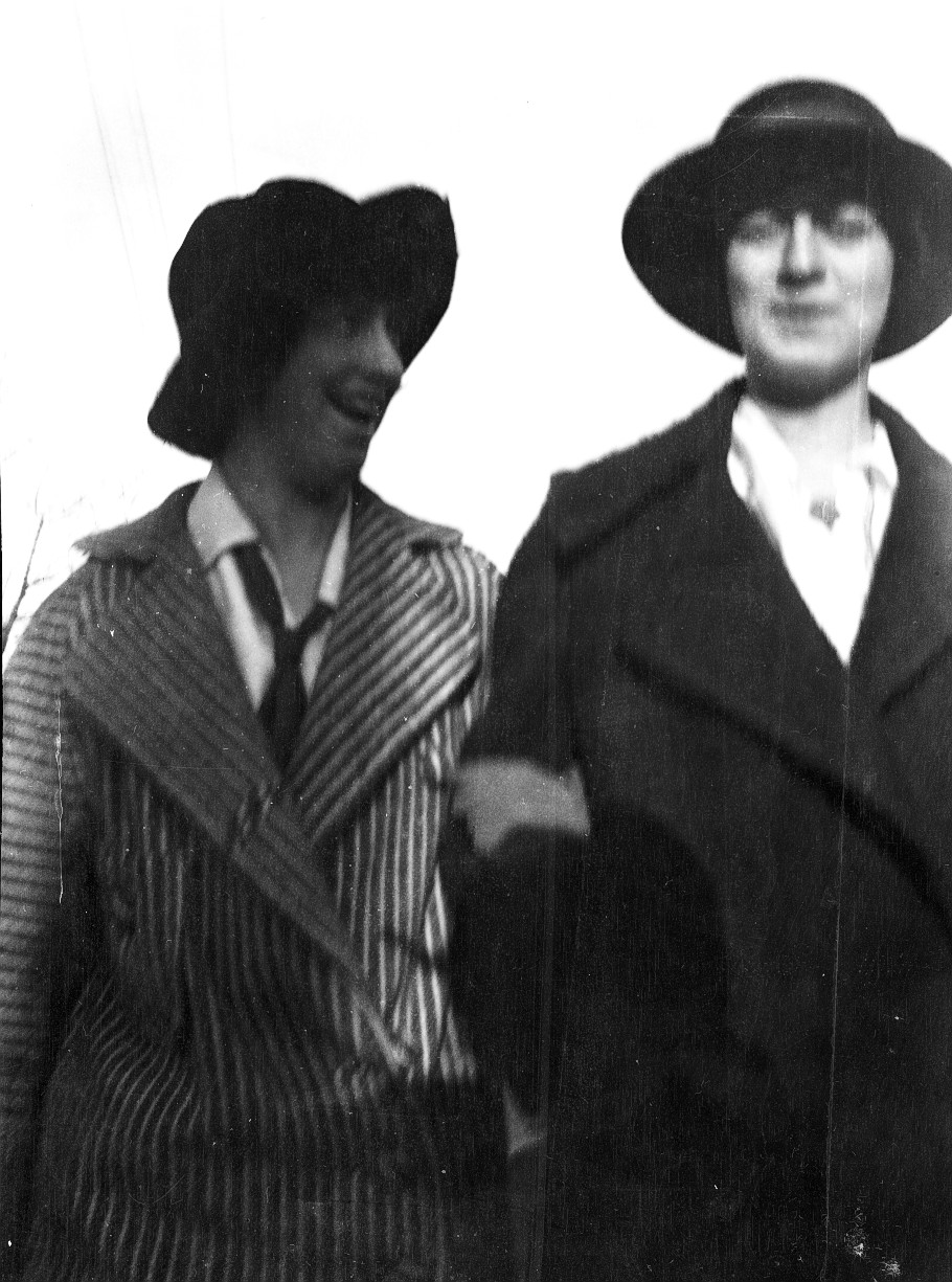 two women in old time fashion standing next to each other