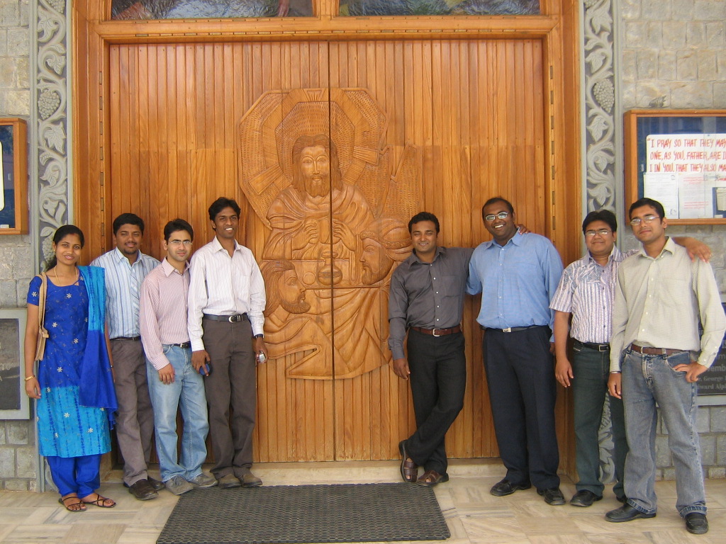 a group of people standing in front of an entrance