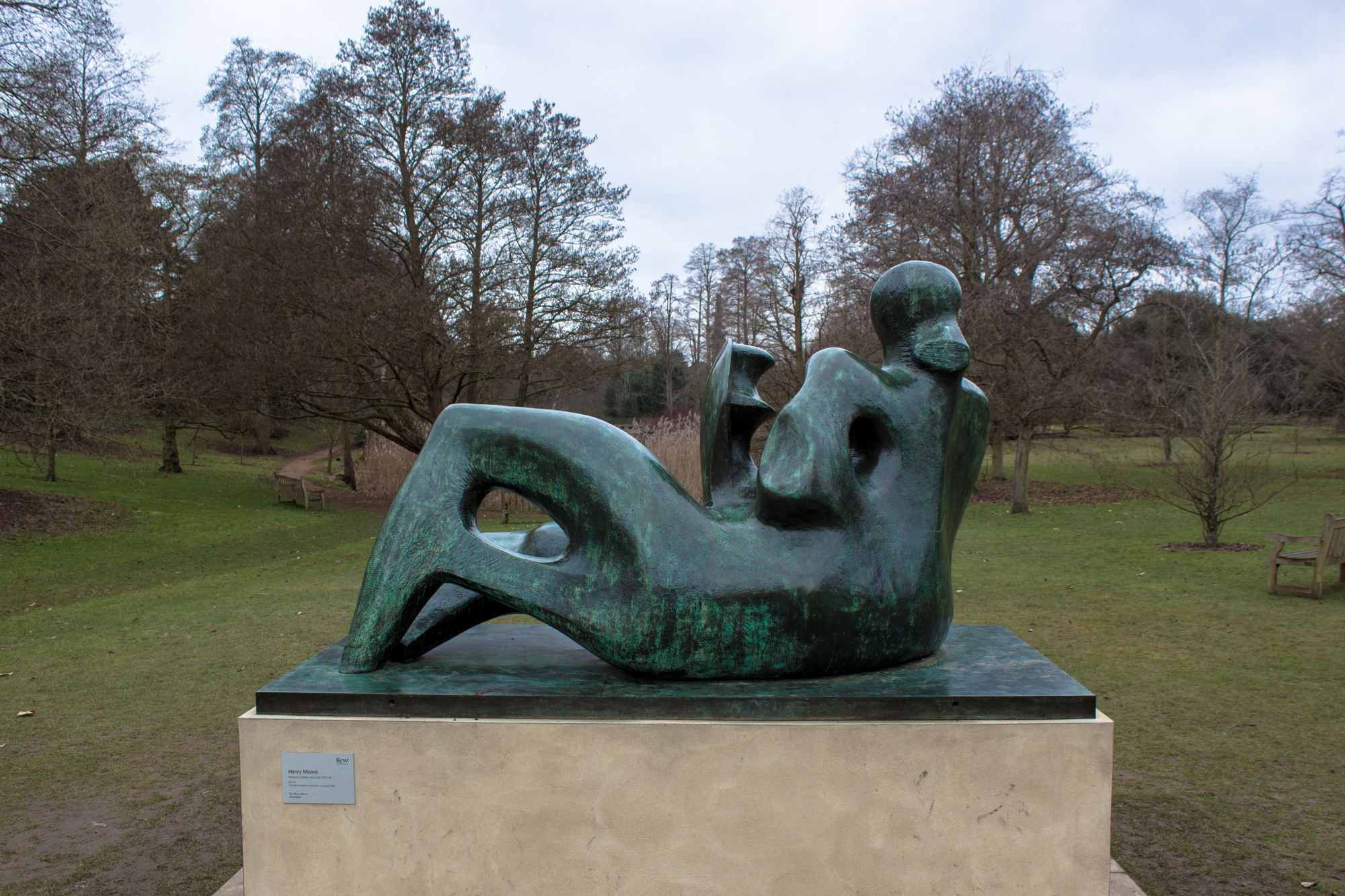 this is a sculpture of a lying woman on her stomach