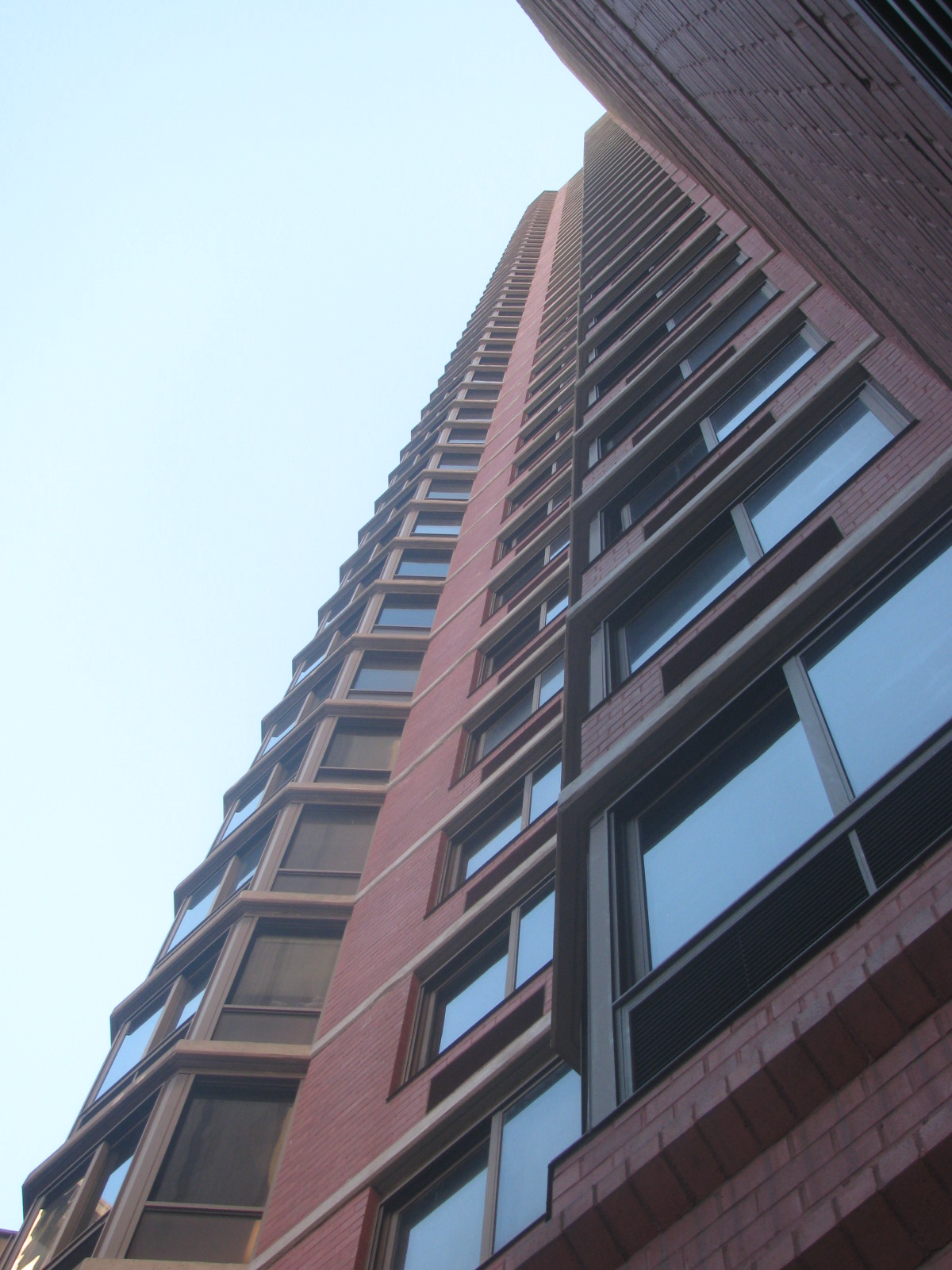 a tall brick building has lots of windows