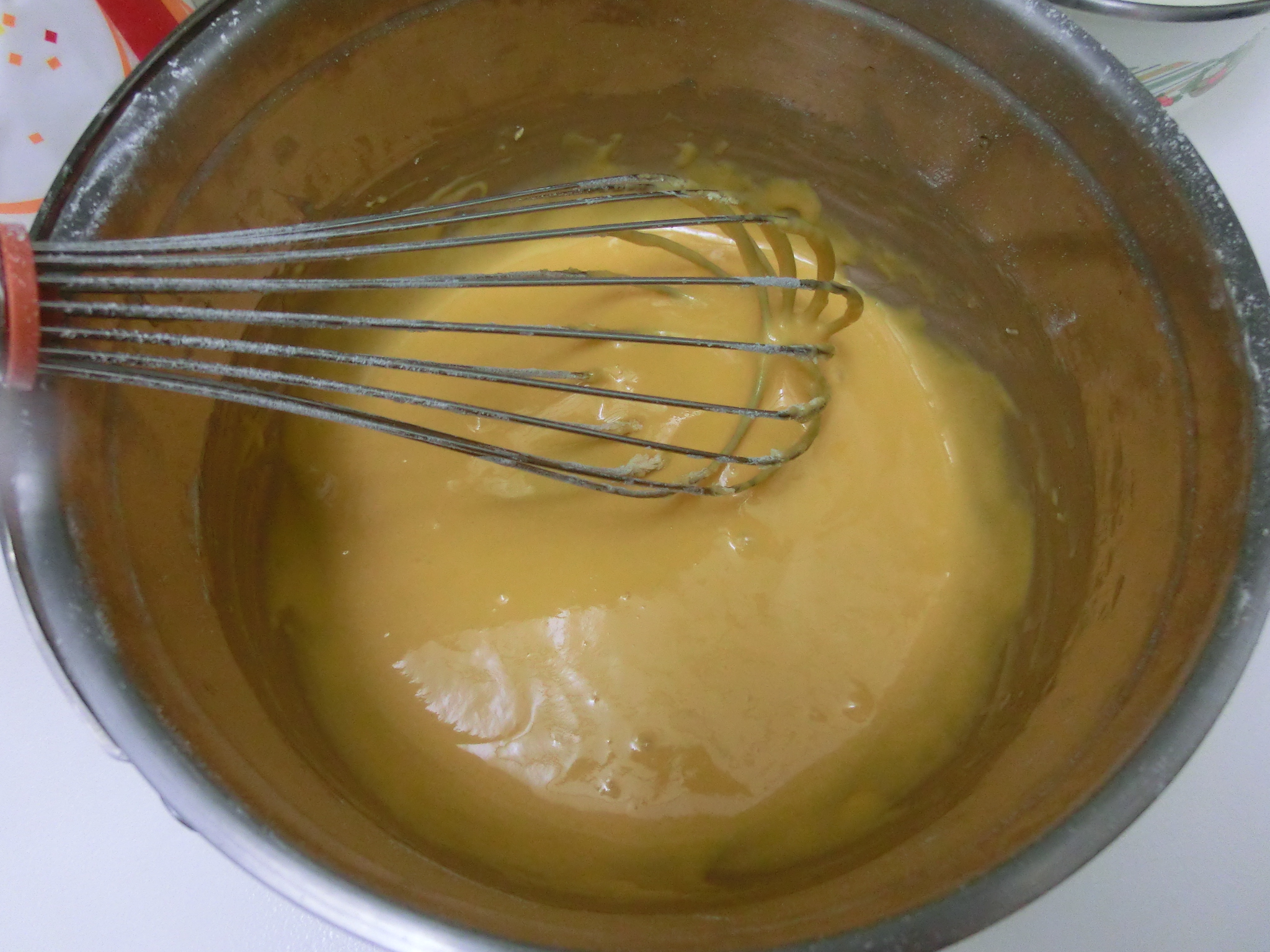 the mixing bowl has been whisked and is full of liquid