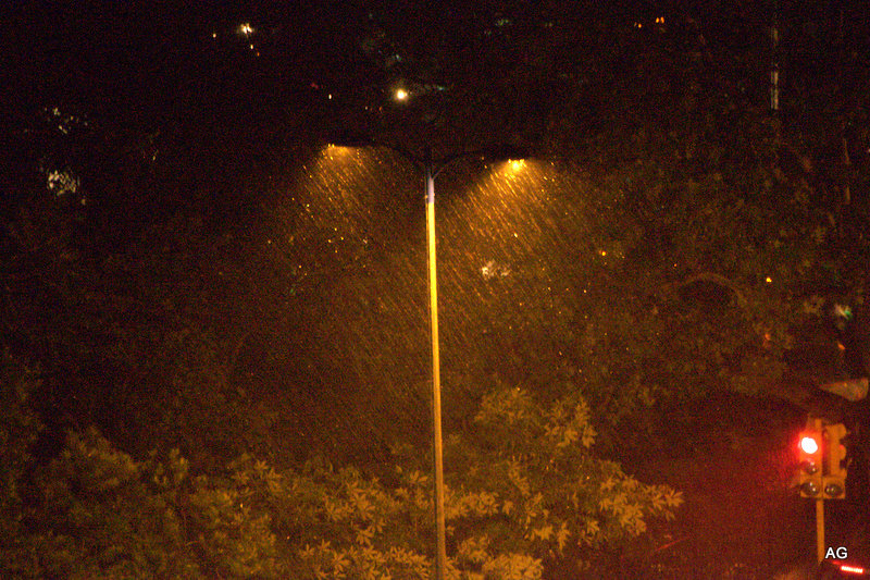 a traffic light on a busy city street at night