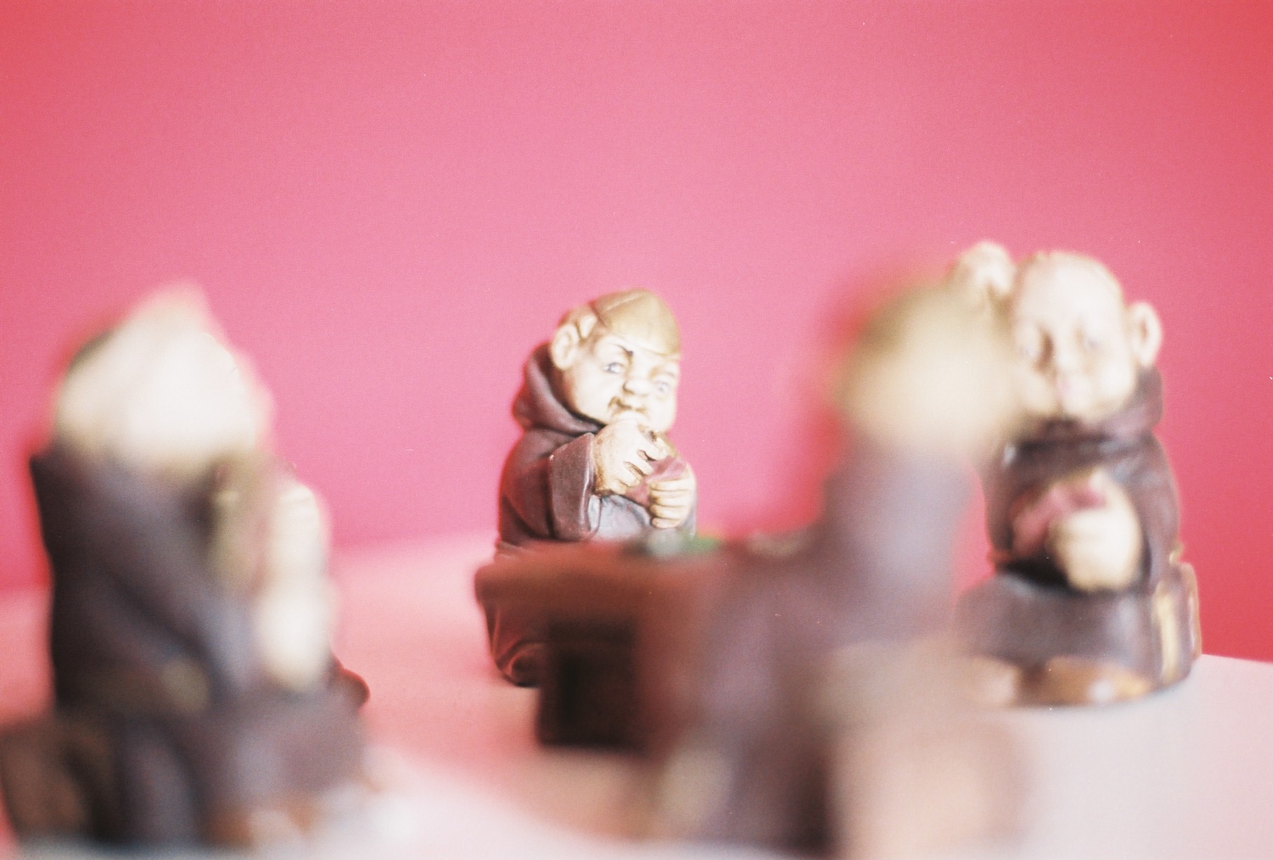 a group of small figurines sitting at a table