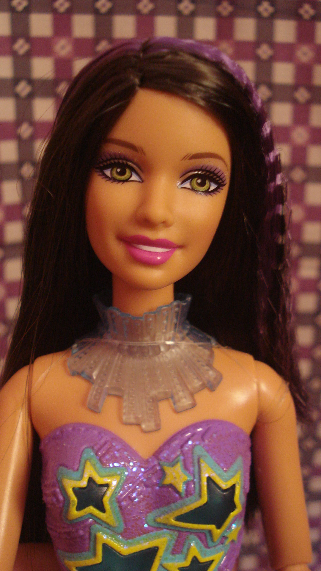 the barbie doll has bright colors with stars
