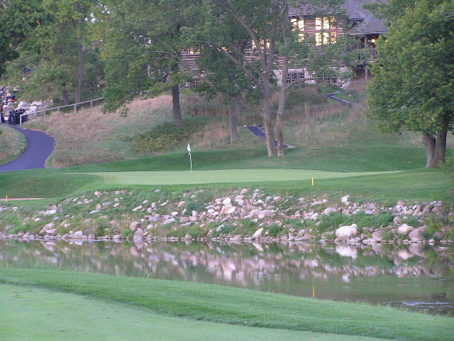 a man in a golf club has a putting green