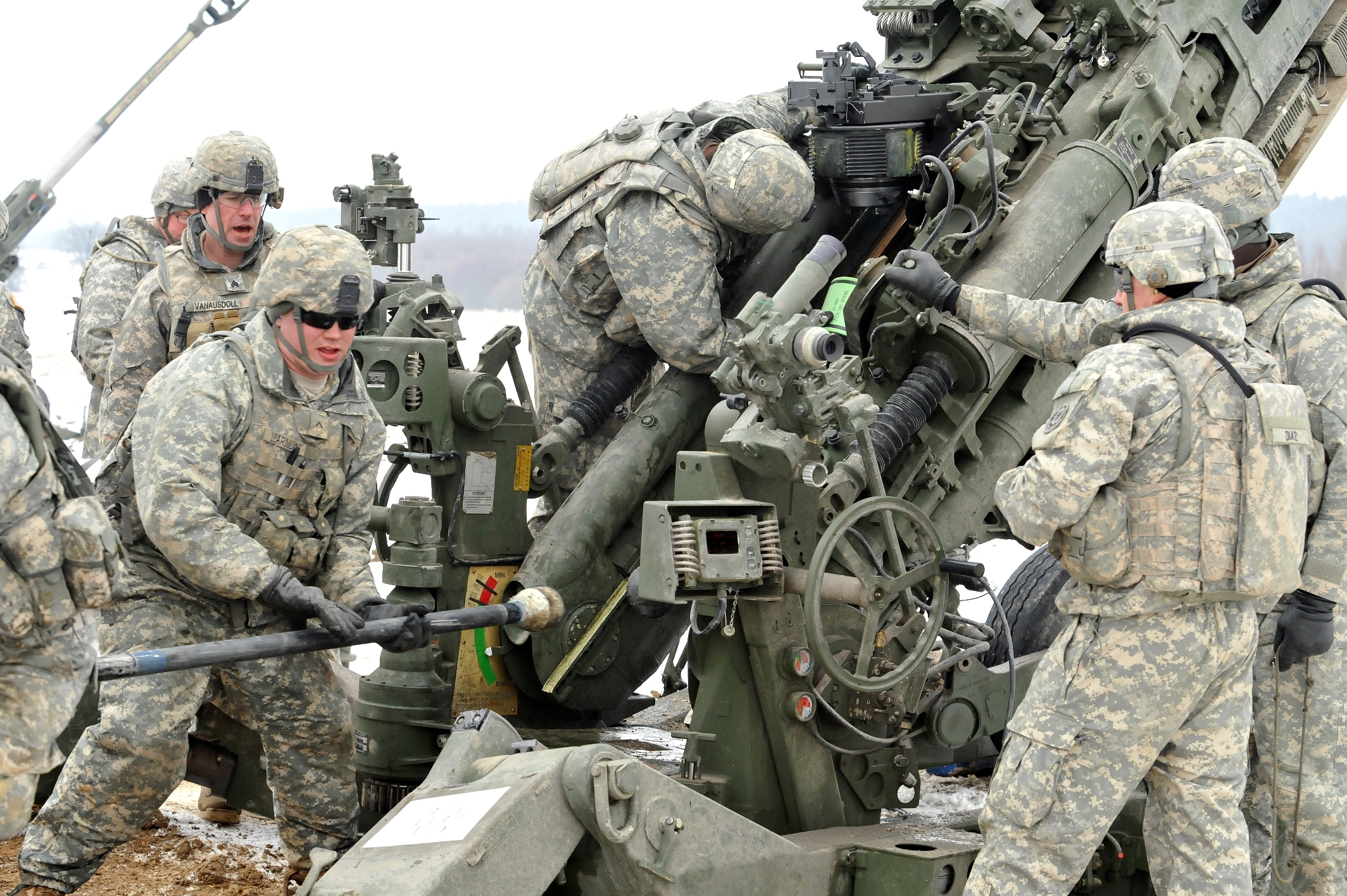 soldiers using equipment in an outdoor area