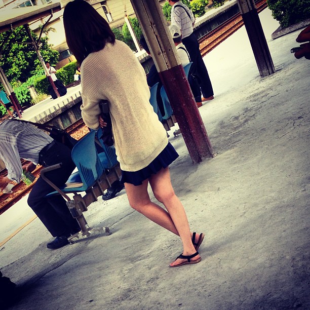a lady in shorts walking away from the camera