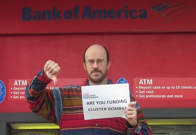 man standing with signs in front of atm machine
