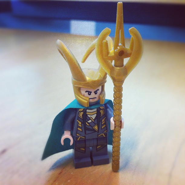 a lego figure of a person with a golden crown on his head