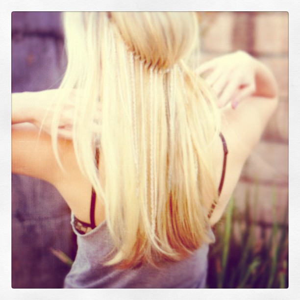 a blond woman with her hair in a ponytail