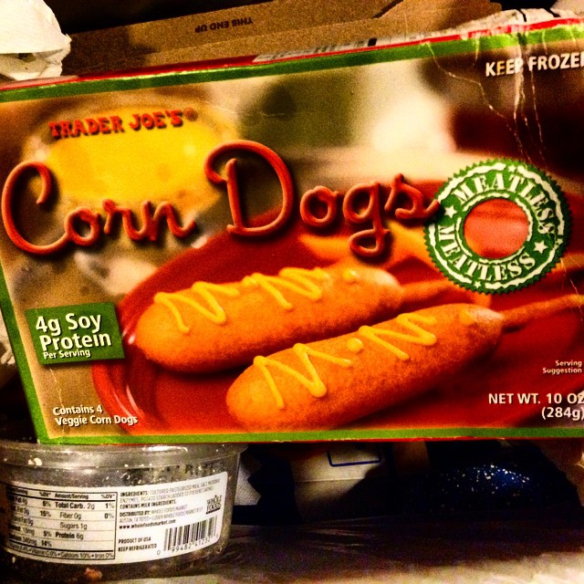 a box of corn dogs and another container full of other food
