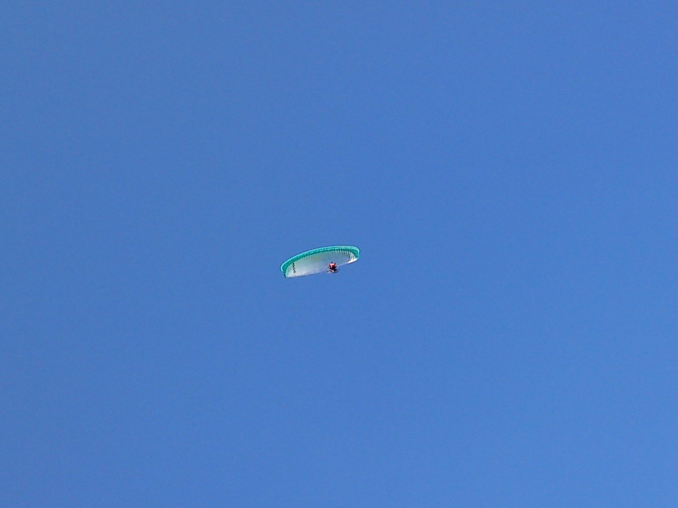 a man on a kite in the air