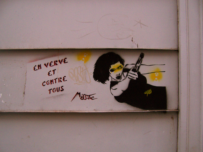 the graffiti shows a woman playing the guitar