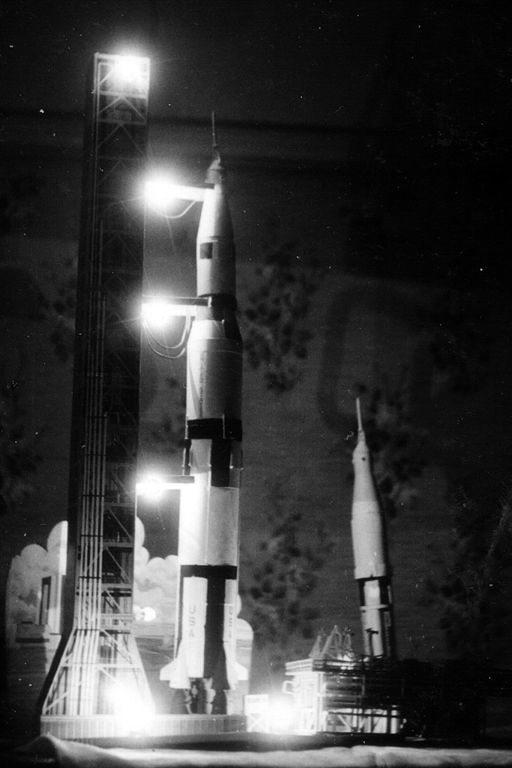 a rocket is sitting on display in a museum