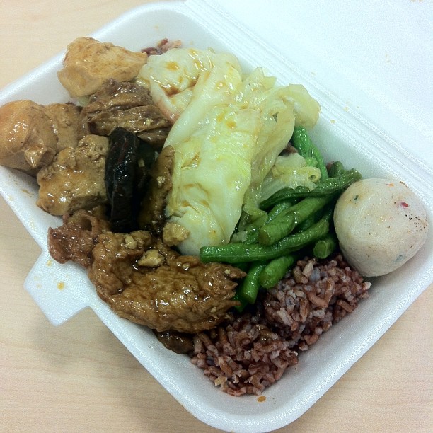 food sitting in a container on a table