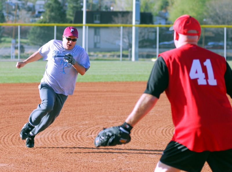 a baseball player about to catch the ball