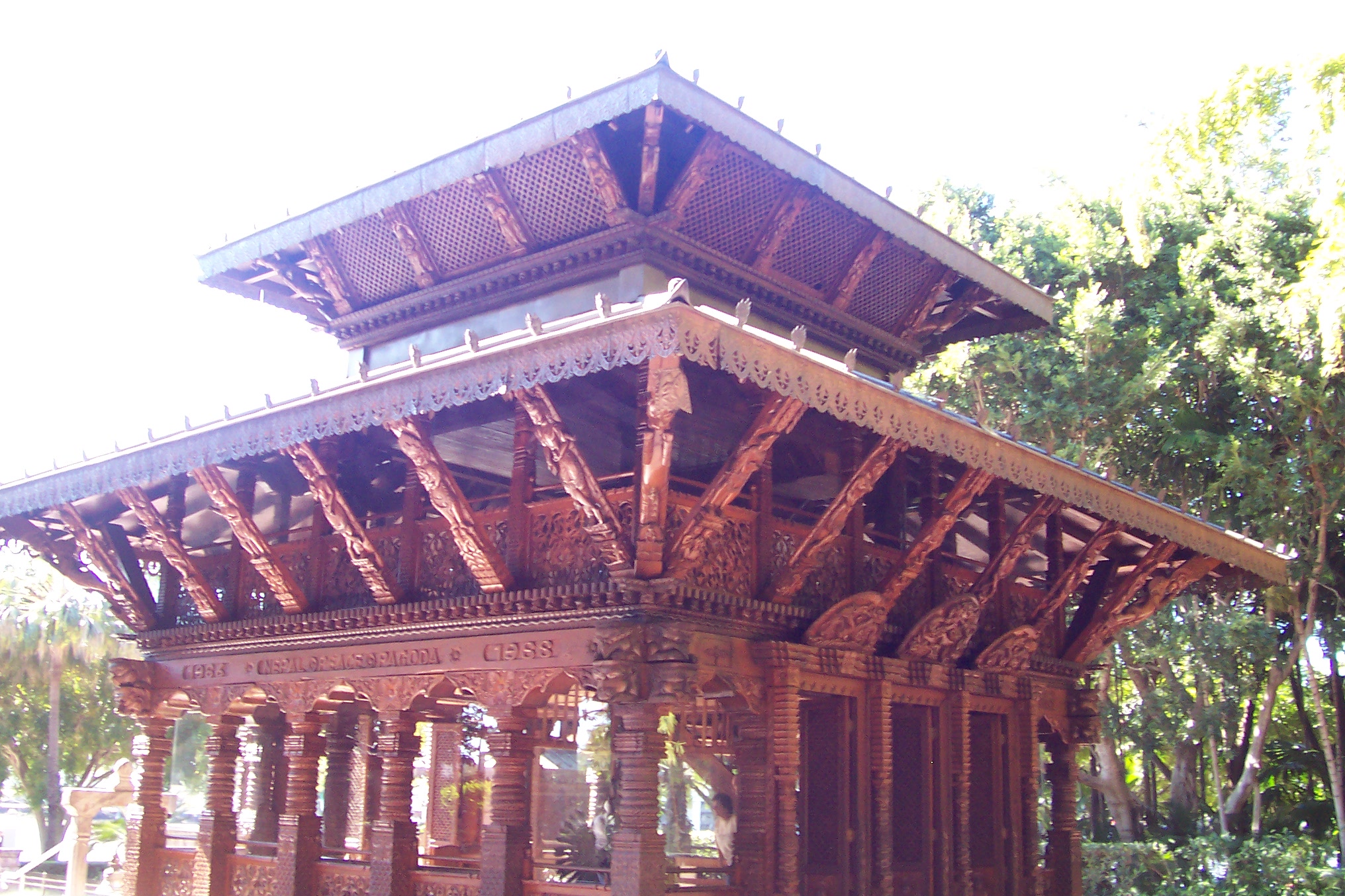 a building with many wooden pillars on top of it