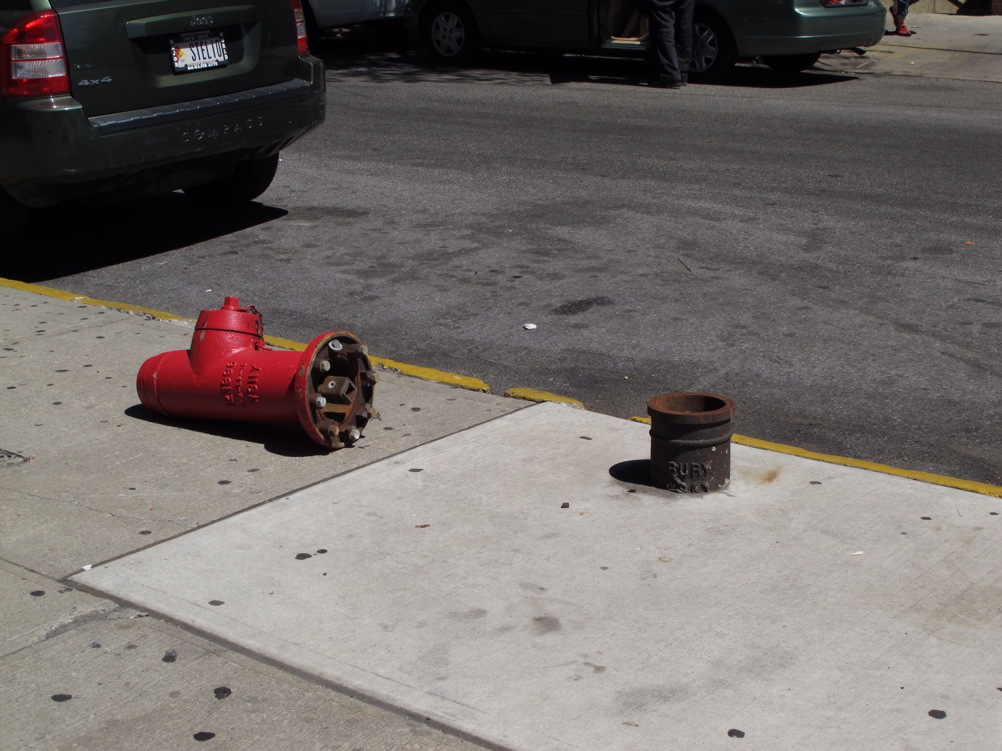 a red fire hydrant on the side of a street