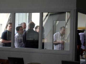 a group of people looking in the window