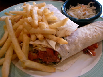a sandwich and french fries are served on a plate