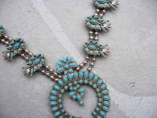 necklace with turquoise beads and white diamonds