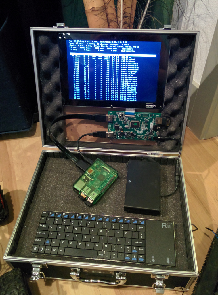 a small laptop with a circuit board in it's case