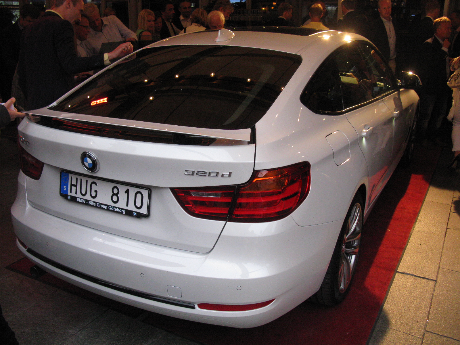 white bmw coupe with license plates on display